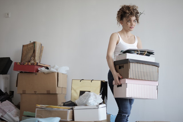 person moving their things into an apartment